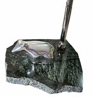 Top view showing metal animal figure on stone base and pen