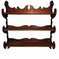 Front view of three-tier wooden shelf showing scalloped detailing