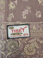 Brand tag THS Tibet Shawl 470 on fabric