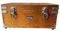 Front view showing latches, label plate, dovetail joints, metal guards