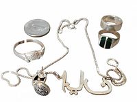 Overview of all sterling pieces: necklace, pendants, two rings