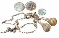 Group shot showing all sterling items: Birks oval earrings, teardrop pieces, chain with charms and coin for scale