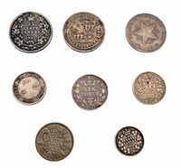 Obverse sides of eight vintage silver coins