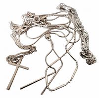 Tangled view of all sterling chains and bracelets with cross pendant
