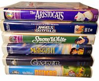 Front spines of six VHS tapes stacked