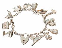 Full view of sterling silver charm bracelet with charms