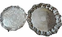 Both round silver plated footed trays side by side to show sizes and design