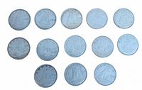 Front view of all thirteen dimes showing Bluenose schooner reverse designs