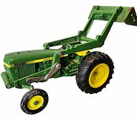 Left front view showing loader arm, body, wheels