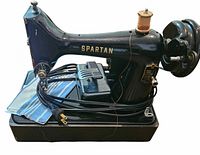 Singer Spartan 192 sewing machine on base with foot pedal, cords and fabric swatch visible