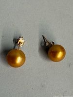 Front view of both pearl studs