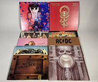 Six of the eight album covers displayed