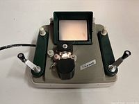Top view showing screen, reel arms, levers and power cord of the Duo-8 Viewmate viewer