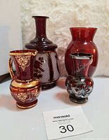 Group shot showing all four ruby red handblown glass pieces
