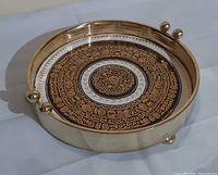 Top view of brass tray showing full ceramic tile design