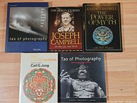 All five books laid out front covers visible