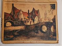 Full view of unframed lithograph showing village scene and overall condition