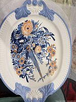 Full view of oval platter front showing pattern and molded rim