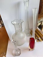 Group shot of all vases, candlestick holder and taper candles