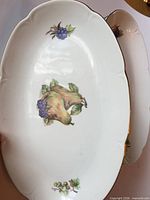 Top view of bowl showing fruit motif and gold trim