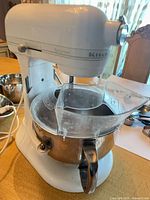 Mixer with bowl and pouring shield attached