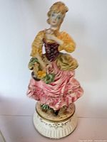 Full view of porcelain figurine on base