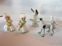 Group shot of all five porcelain figurines