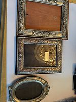 All three silver frames laid out