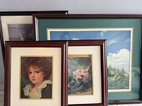 Group shot of all four framed prints showing frame style and subjects