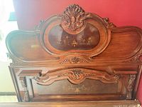 Full view of carved queen headboard with inlay