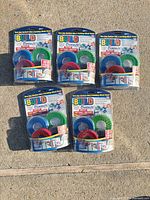 Front view showing five sealed Build Bonanza tape packs
