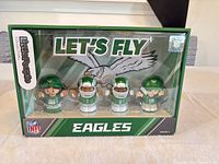 Front view of sealed Little People Eagles Series 2 set showing four figures