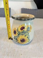 Front view of ceramic vase with sunflower design and height measurement