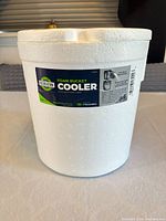 Foam bucket cooler front with brand label visible