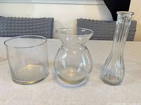 Front view of the three clear glass vases
