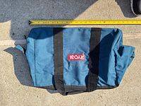 Ryobi soft-sided tool bag exterior with tape measure along length (~18 in)