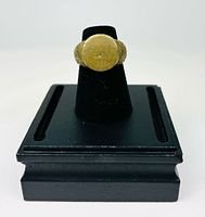 Ring on black display showing bezel and band