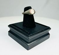Oblique view of ring on display stand showing bezel with carnelian intaglio