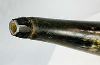 Close view of faceted spout end with plug