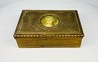 Front and top view of gilt bronze box, portrait miniature visible
