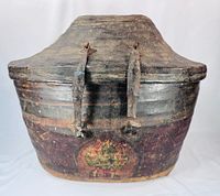 Front view showing basket shape, leather straps and painted surface