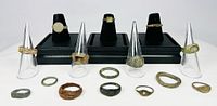 Full group of 15 rings on stands and flat