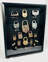 angled front view of shadow box with all locks and keys