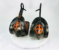 Front view of both stirrups showing clan crest and lacquer wear