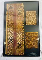 Framed display showing all three textile fragments