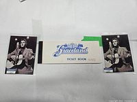 Two Elvis trading cards and Graceland ticket book front cover