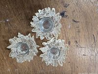 Top view of three faux crystal votive holders showing overall design