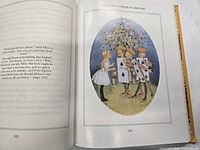 Open book pages 162-163 with Queen’s Croquet Ground illustration
