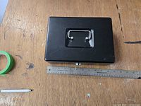 Top view showing overall form, handle, color and included ruler for scale