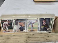 Front view of box showing several sleeved Upper Deck cards including Doug Drabek